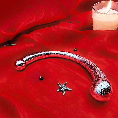 Stainless steel dildo with ergonomic curves for targeted G-spot and prostate stimulation, suitable for solo and couple play.