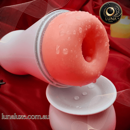 Close-up of the soft entrance in a white cup on red satin—realistic stretch for a tight grip.