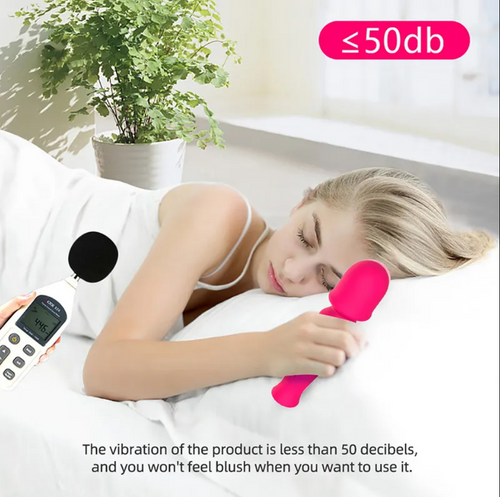 A hand holding The Luxe Wand, showcasing its compact, travel-friendly size and lightweight, ergonomic design for comfort and convenience.