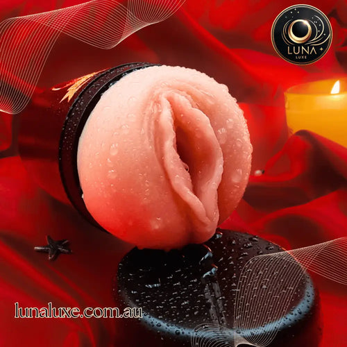 Close-up of the soft, realistic sleeve on red satin—ultra-stretch grip for tight, milky strokes.