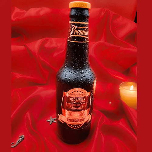 Discreet beer-bottle shell on satin, a stealth toy that looks like a drink.