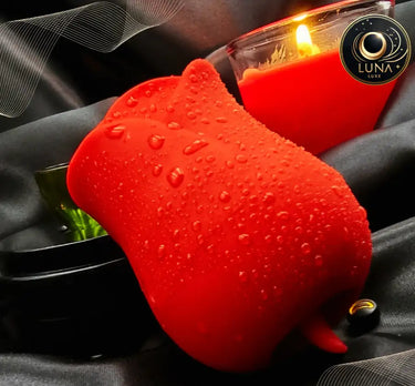 Red rose bud vase with water droplets, luna candles brand.