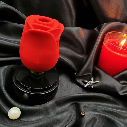 A hand holding The Kiss of Bliss, showcasing its compact, travel-friendly size and ergonomic design.