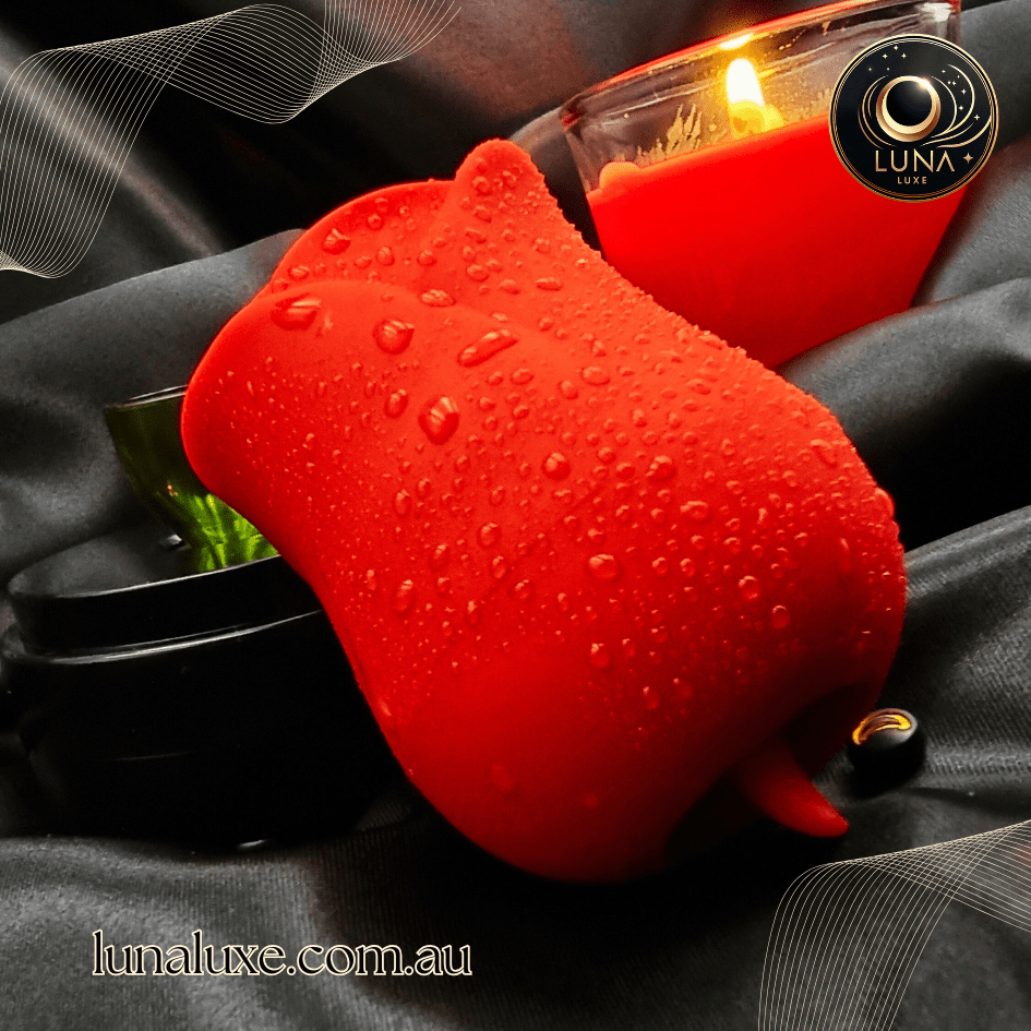 Rose clitoral sucker on black satin—air-pulse suction toy in soft, body-safe silicone.