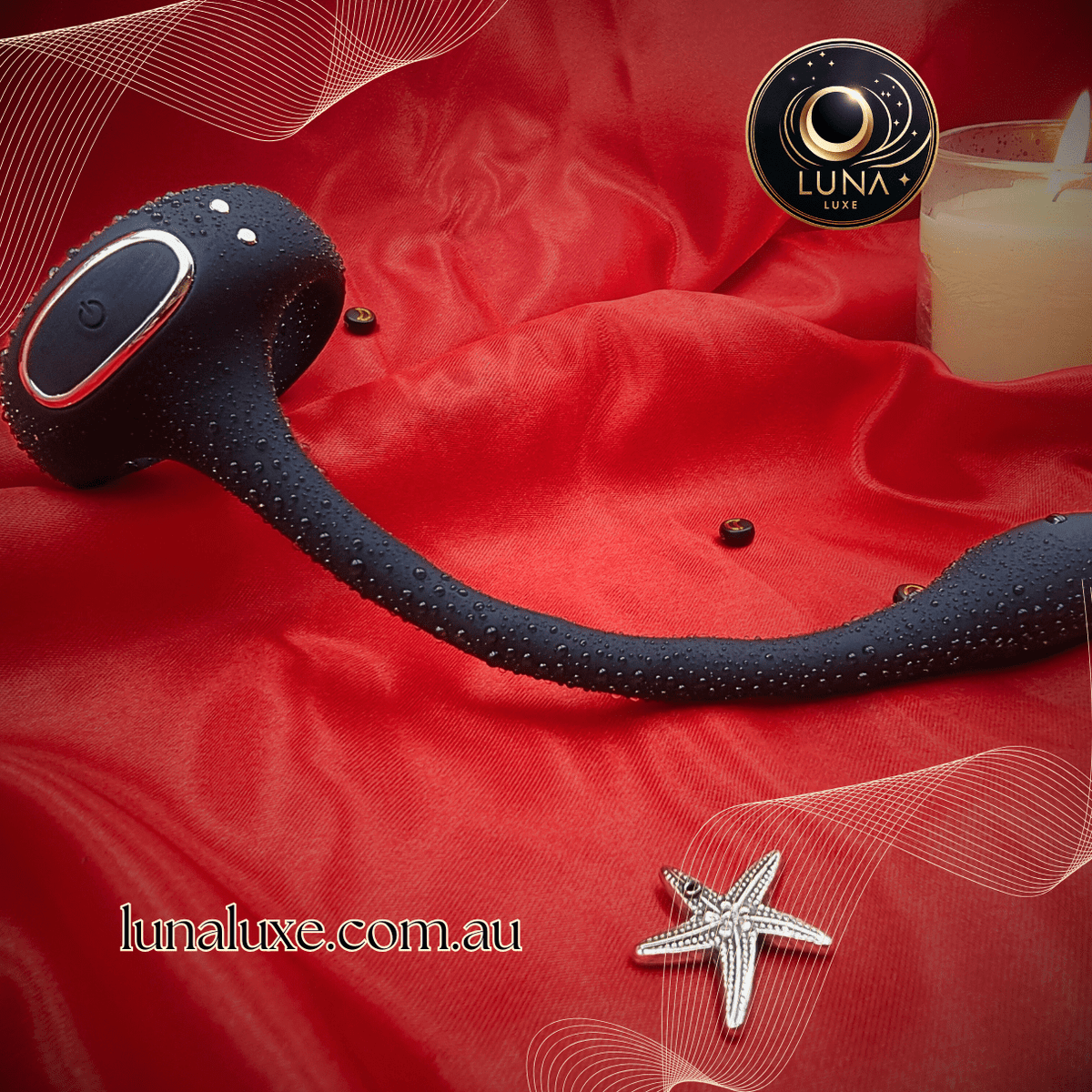 Black app-controlled prostate massager on red satin with water droplets, curved head and perineum arm.