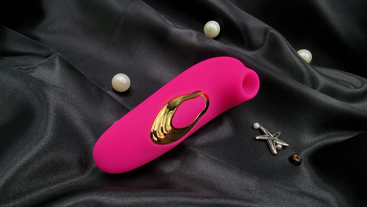 Side profile on fabric showing the plush silicone mouth for sealed clitoral suction.