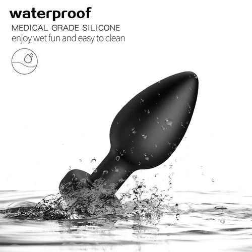 IPX7 waterproof vibrating anal plug shown with water splash graphic, safe for shower or bath use.