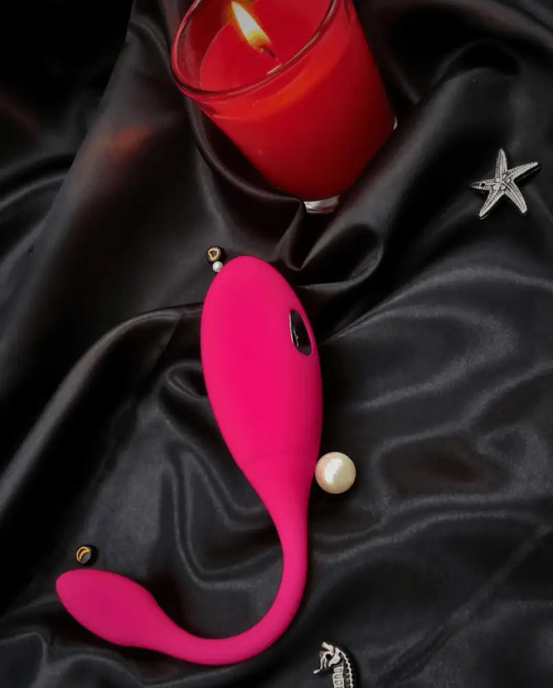 Side view showing flexible neck and textured clitoral pad in smooth body-safe silicone.